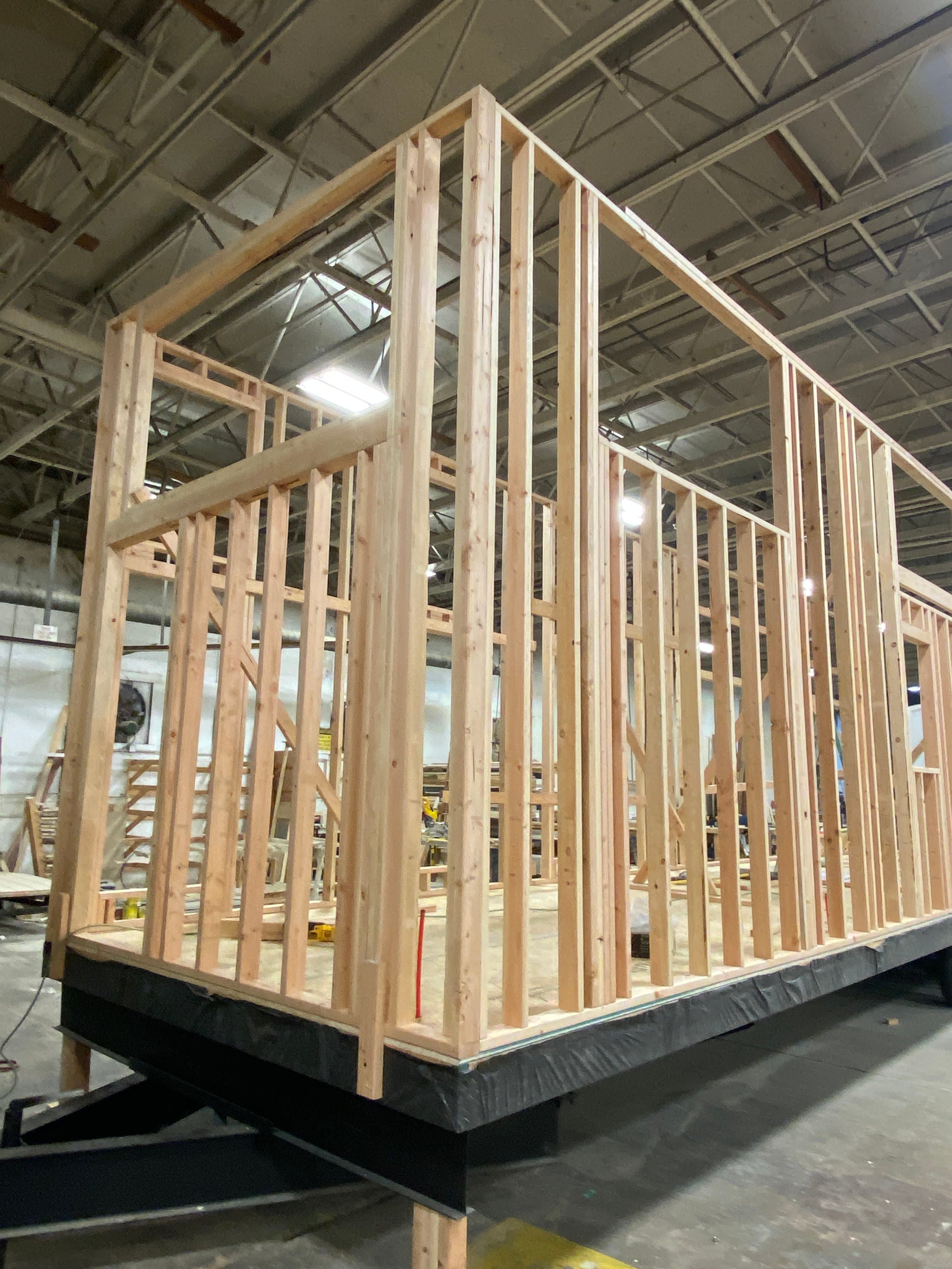 Montera Homes factory build — interior wall sheathing and electrical rough-in