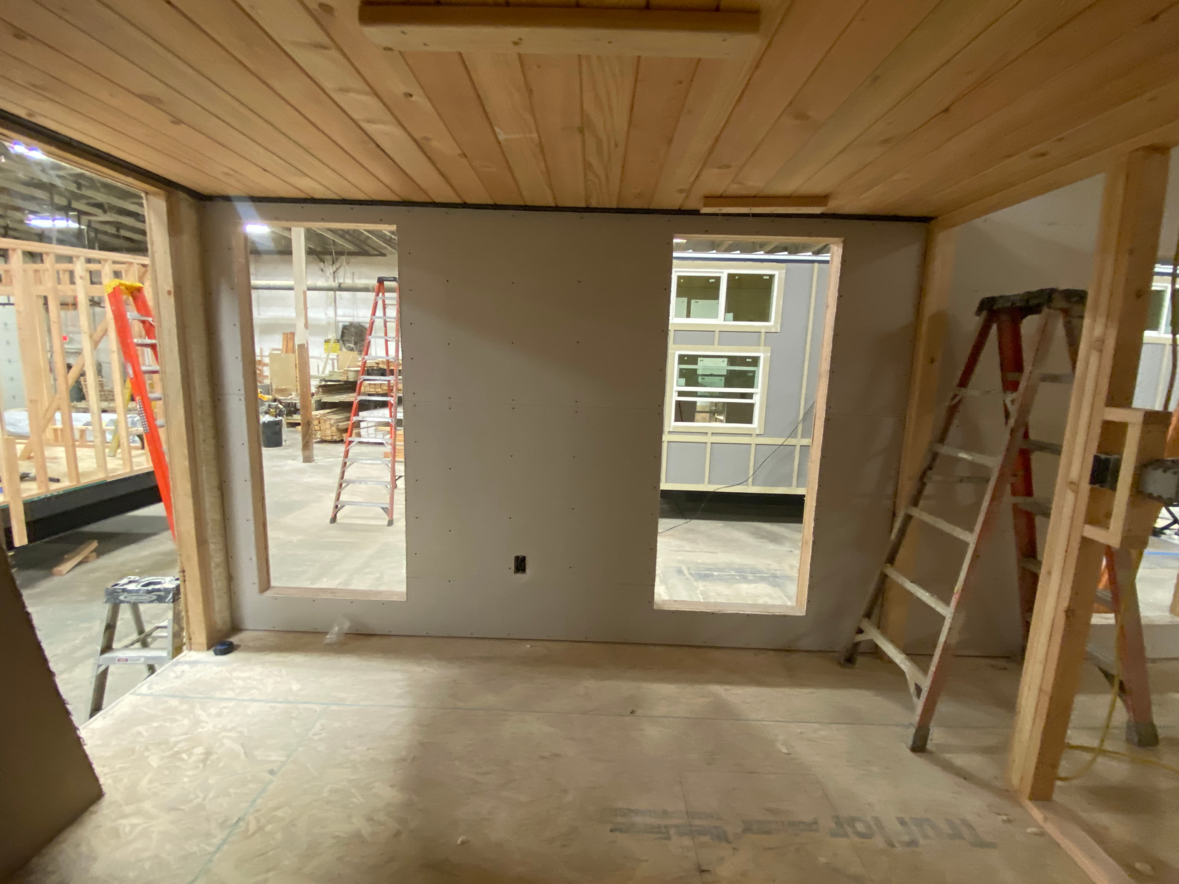 Montera Homes factory build — window and door frame installation