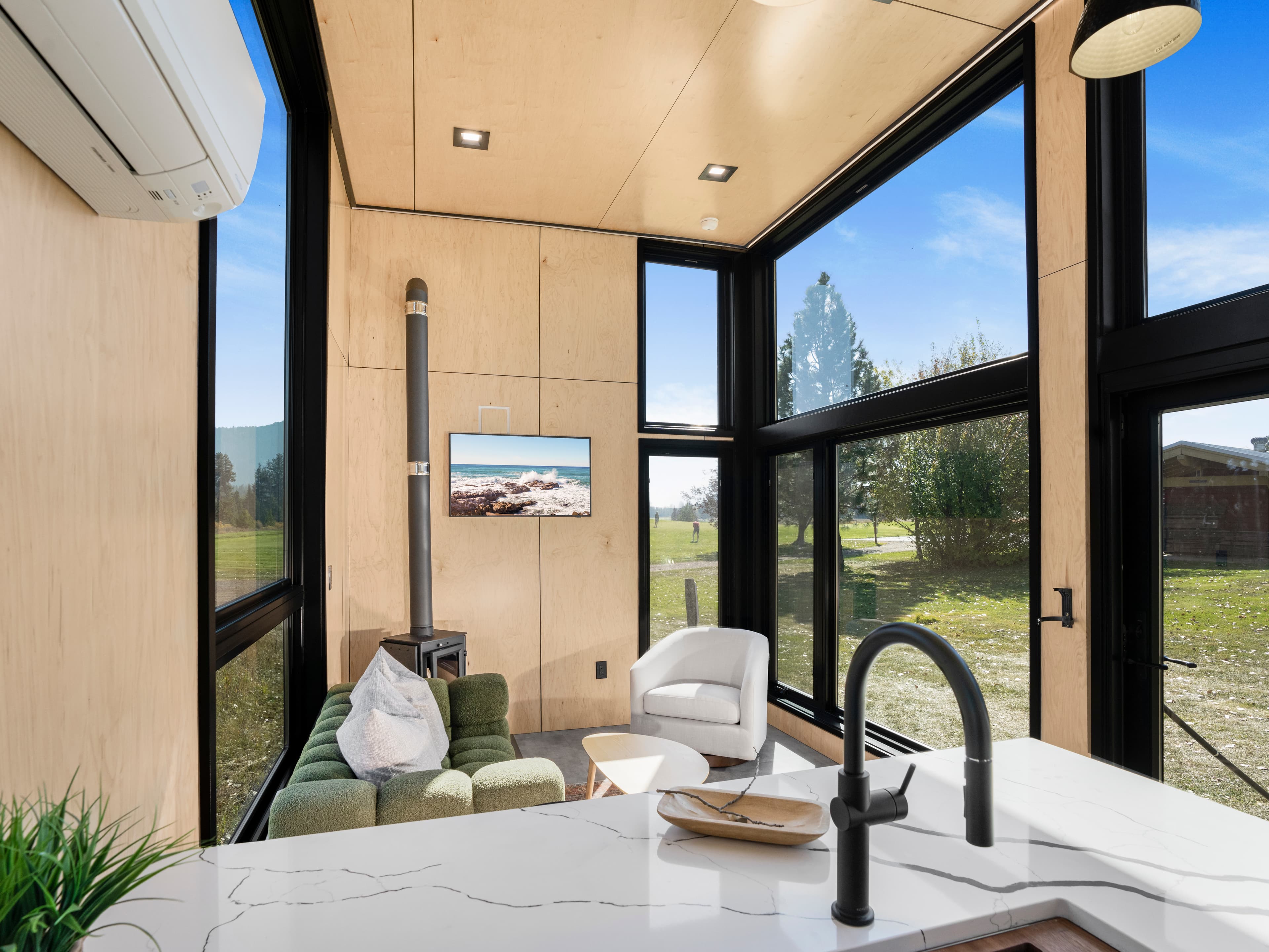 Montera Homes luxury interior — custom tile shower with niche and glass door