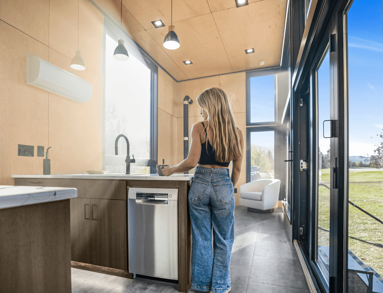 Montera modular home interior rendering — living space with large sliding door